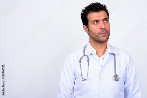 Handsome Turkish man doctor against white background