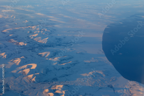 Snowy mountains of Canada from 30,000 feet - aerial view - shot November flight from LAX to S Koreak November 2013 photo