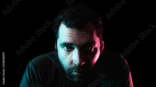 Fotografie Male portrait in a low key in the Studio