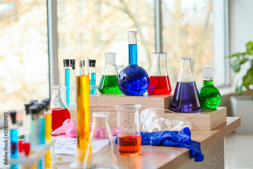 Laboratory glassware with samples on table in classroom