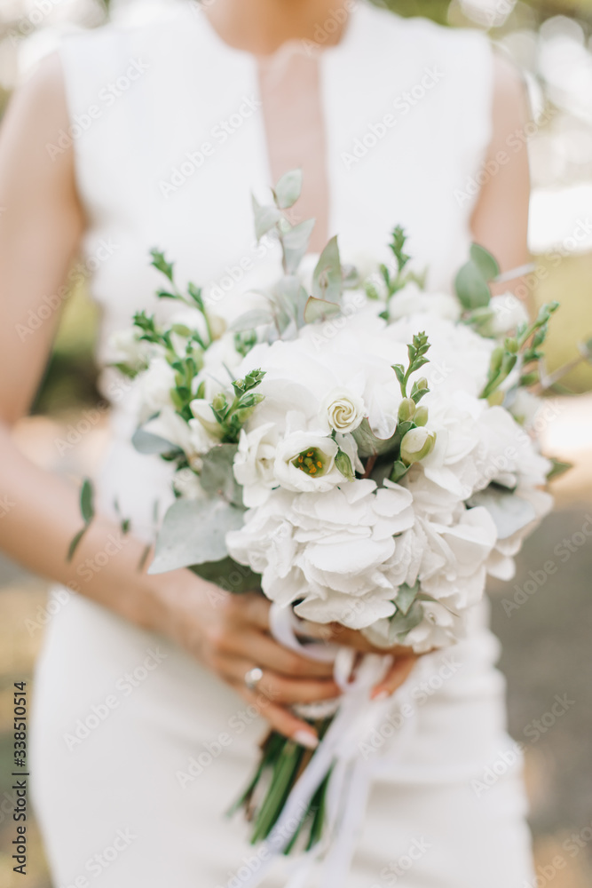 blooming bouquet in the hands of the bride blooming bouquet in the hands of the bride