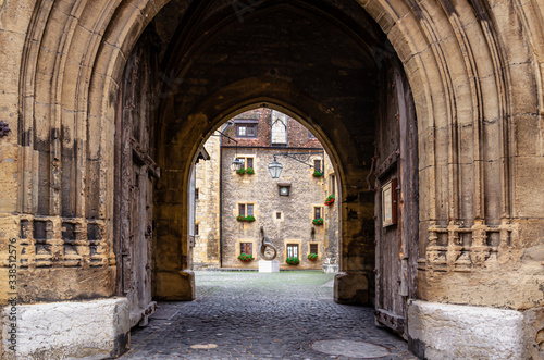 Ancient gate leading to the courtyard of the Neuch  tel castle in the old city of Neuenburg  Switzerland