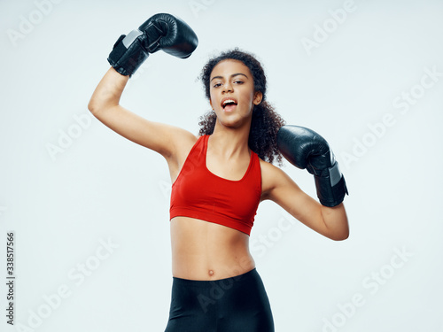 woman wearing boxing gloves © SHOTPRIME STUDIO