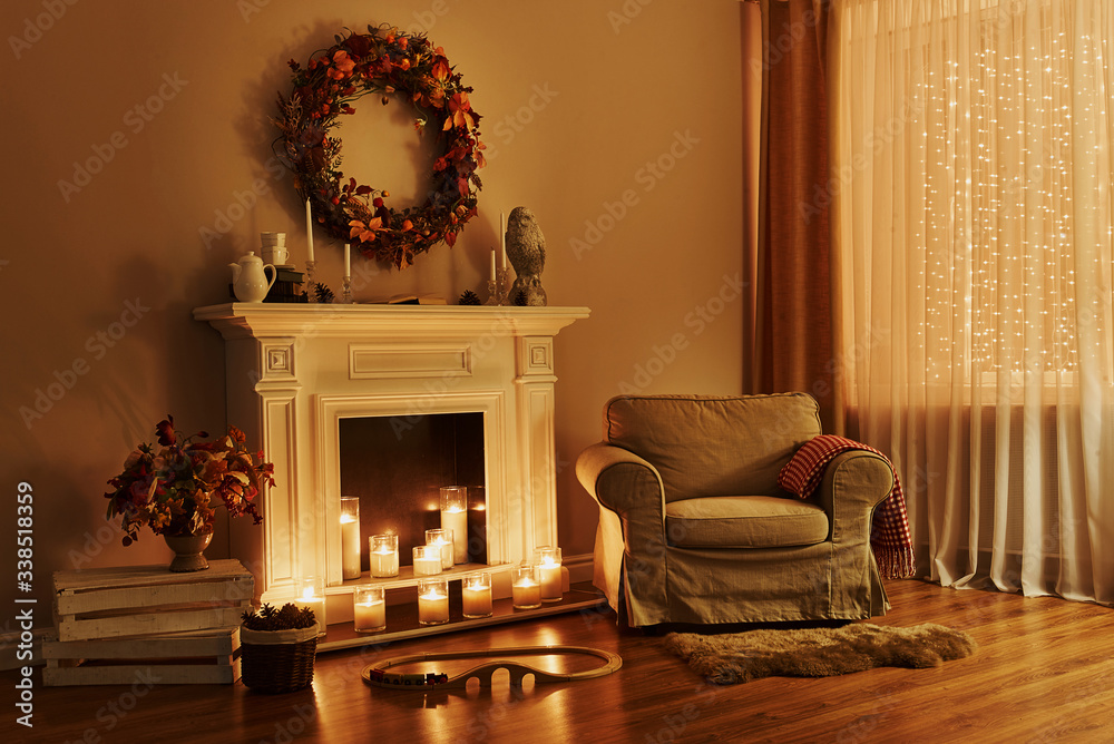 Cozy fireplace with armchair. Interior in a cozy house