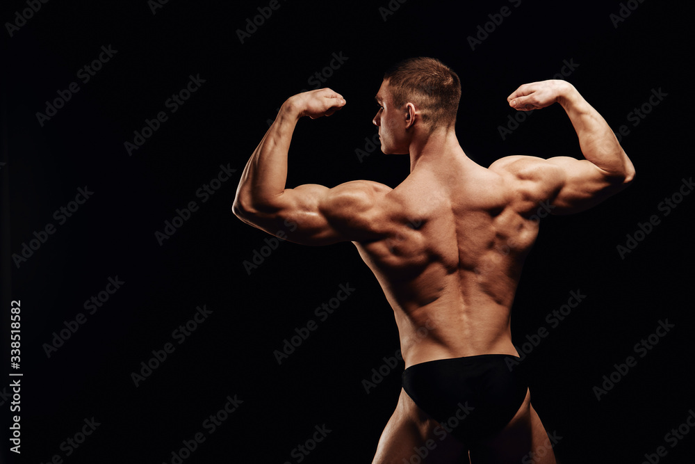Strong men posing and showing muscles. Great shape before championship. Perfect for sport nutrition promo. Athlete and bodybuilder. Close-ups. Black background. Strong men posing and showing muscles. Great shape before championship. Perfect for sport nutrition promo. Athlete and bodybuilder. Close-ups. Black background.