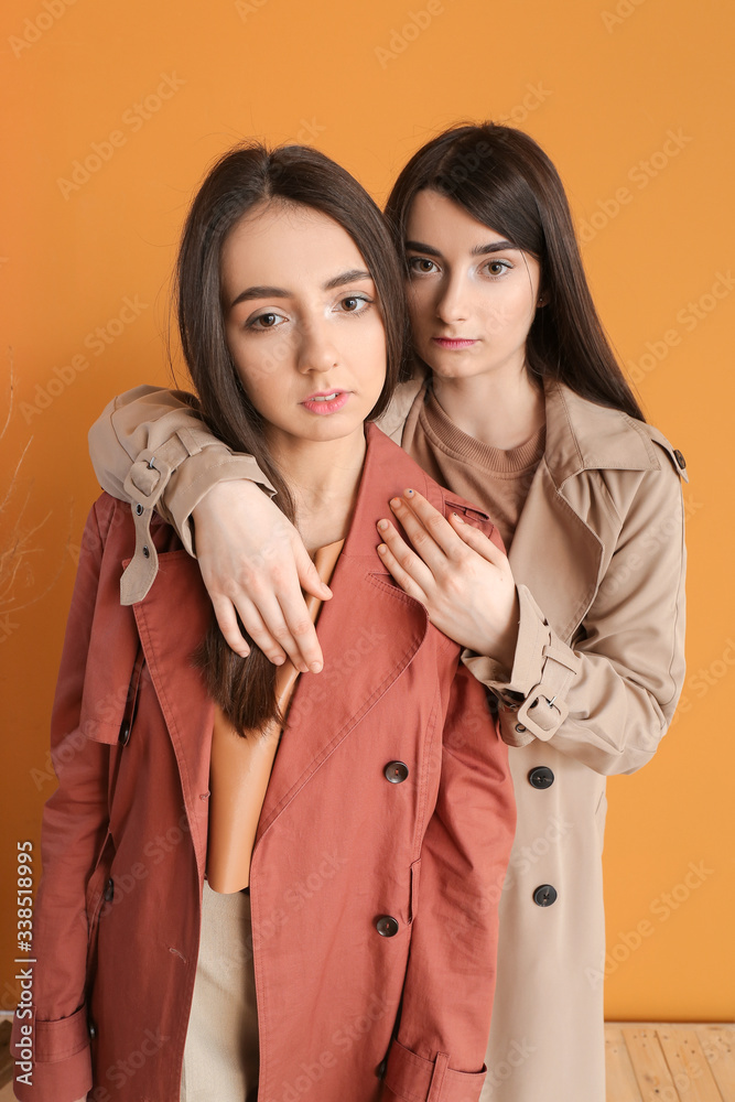 Stylish young women on color background Stylish young women on color background