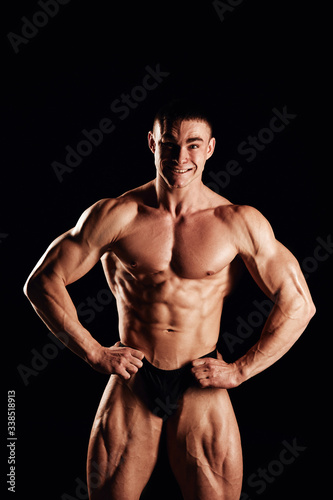 Strong men posing and showing muscles. Great shape before championship. Perfect for sport nutrition promo. Athlete and bodybuilder. Close-ups. Black background.