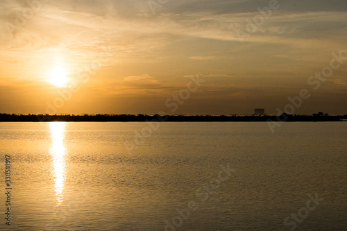 sunrise over lake, launch pad in background, cape canaveral