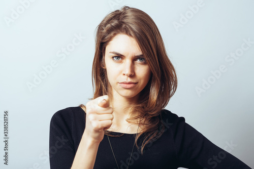 Fotografia attractive woman showing fig gesture isolated