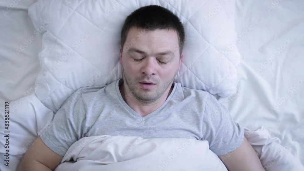 Shocked male person waking up fast. Tired man oversleep in morning. Sleepy relax concept. Shocked male person waking up fast. Tired man oversleep in morning. Sleepy relax concept.