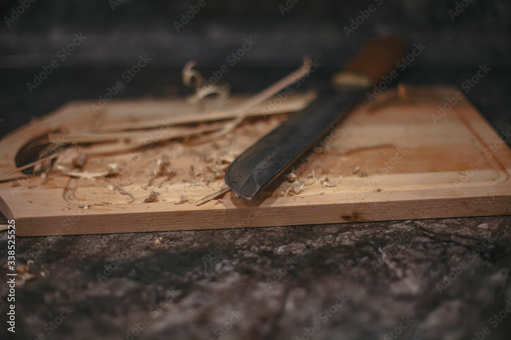 wooden bar lying with a knife on the table wooden bar lying with a knife on the table