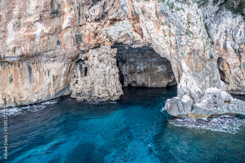Natural caves in gulf of Orosei with turquoise water
