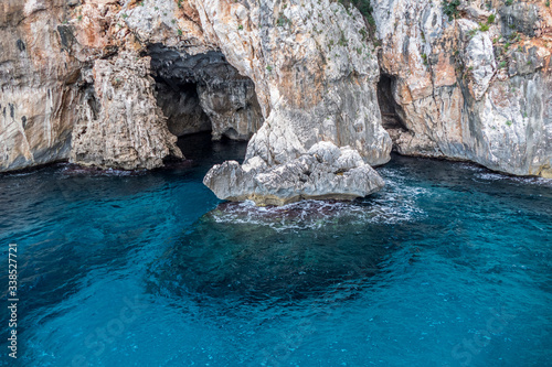 Natural caves in gulf of Orosei with turquoise water