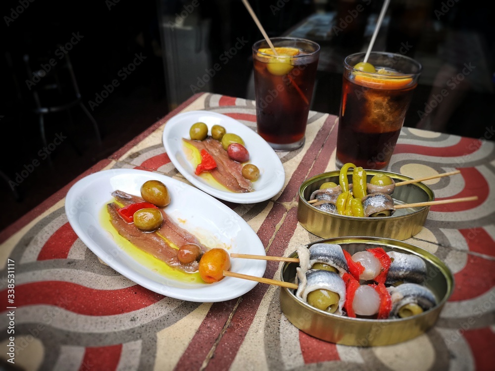 Anchovies, olives and vermouth, Spanish tapas and drink typical of Barcelona, Spain. Anchovies, olives and vermouth, Spanish tapas and drink typical of Barcelona, Spain.
