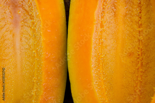 close up of a slice of papaya