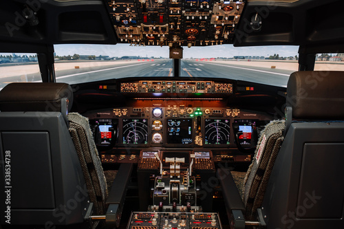 Full view of cockpit modern Boeing aircraft before take-off. Airplane is ready to fly. Landscape shot