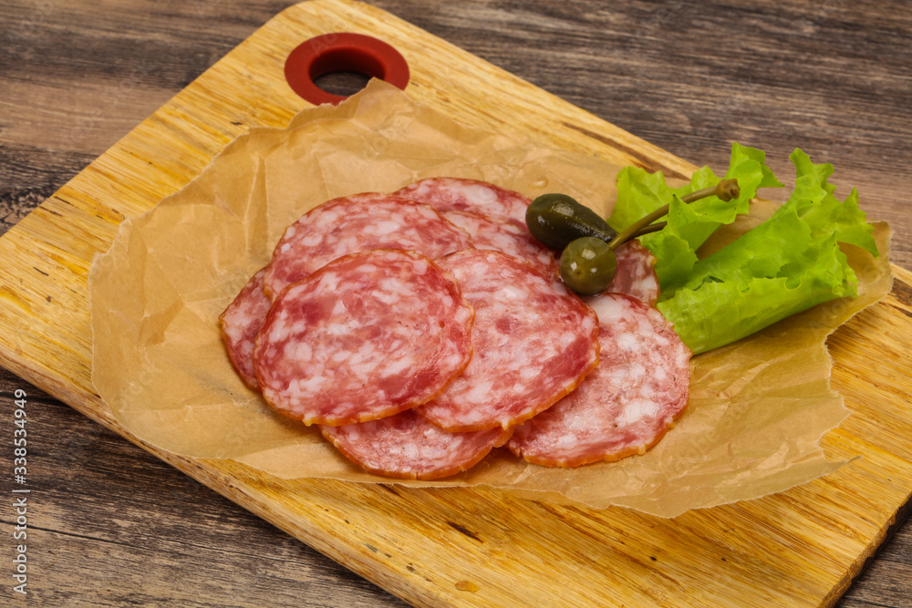 Spanish Salchichon sausage with salad Spanish Salchichon sausage with salad