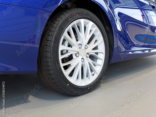 Car showroom. Aluminum wheel with Tire photo