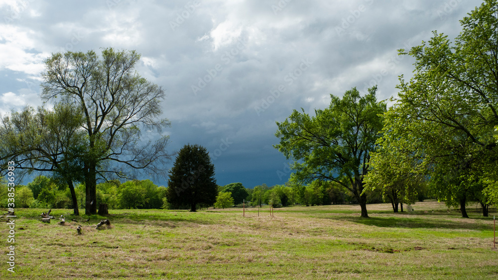 Storm approaching in the spring countryside, dark threatening thunder storm clouds Storm approaching in the spring countryside, dark threatening thunder storm clouds
