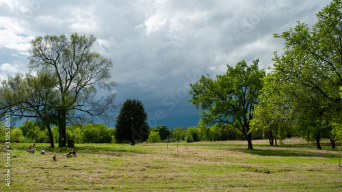 Storm approaching in the spring countryside, dark threatening thunder storm clouds 