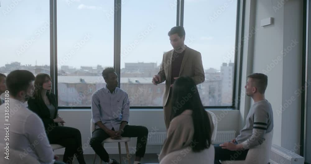 Vidéo Stock Pensive man in formal clothes talks about problem of his