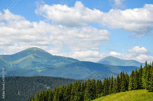 Summer panorama of Chornohora mountain range. View on mount Hoverla and mount Petros, Carpathians mountains in Ukraine.