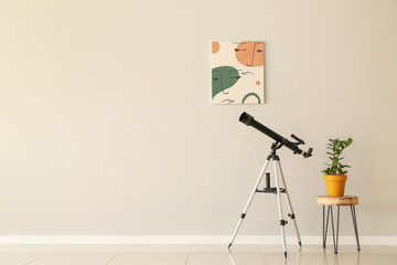 Interior of modern room with telescope
