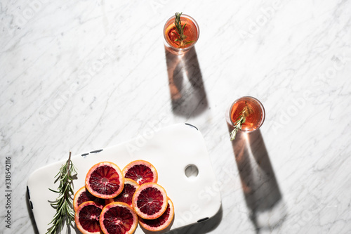 Cocktails in the sun with blood oranges