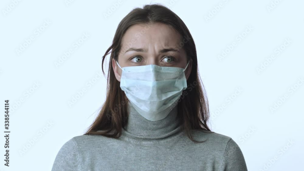 Girl in medical mask nervously breathes, moves eyes panic of epidemic covid-2019 Girl in medical mask nervously breathes, moves eyes panic of epidemic covid-2019