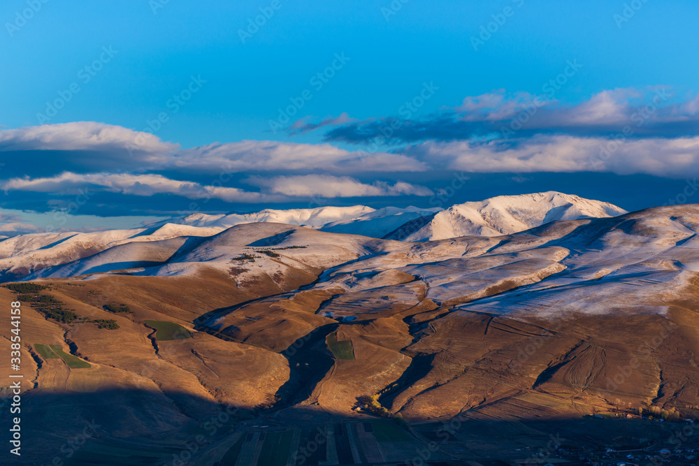 Beautiful snowy mountain landscape with settlements, Armenia