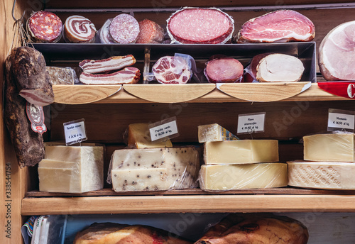 Cheese and meat in Antica Formaggeria Bernadi store in historic part of Bologna city, Italy photo