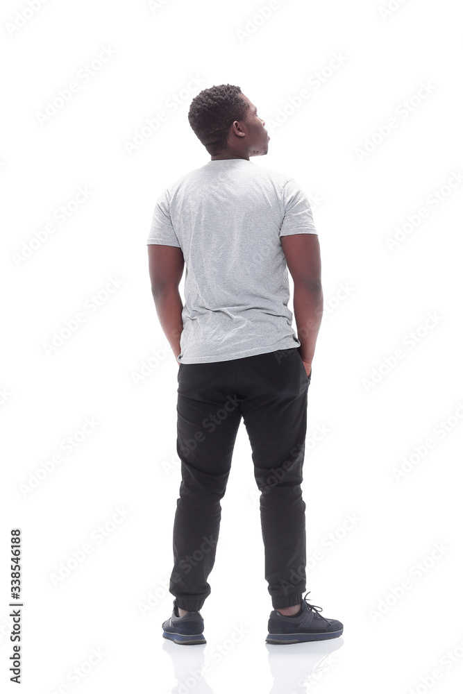 rear view. young man looking at white blank screen. rear view. young man looking at white blank screen.