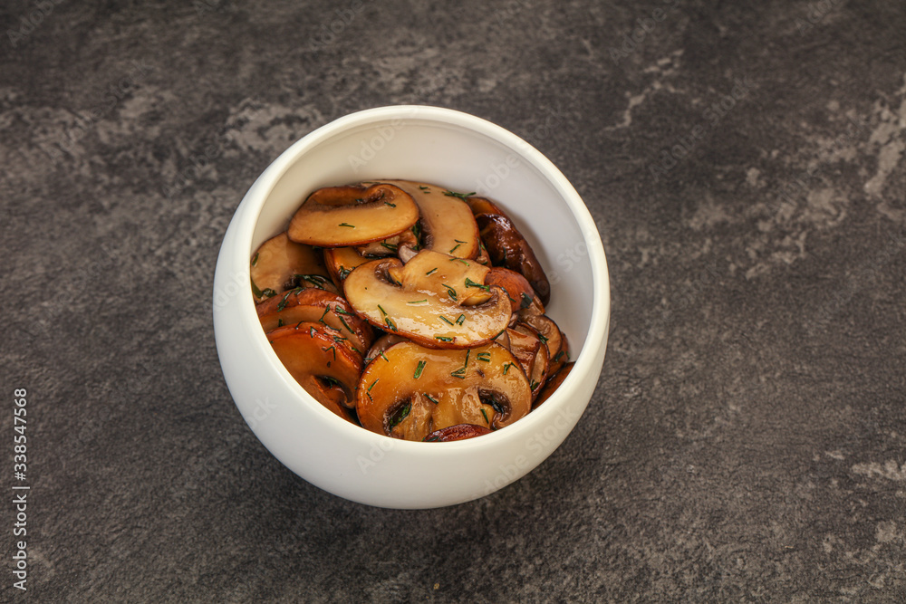 Roasted champignon with herbs and spices