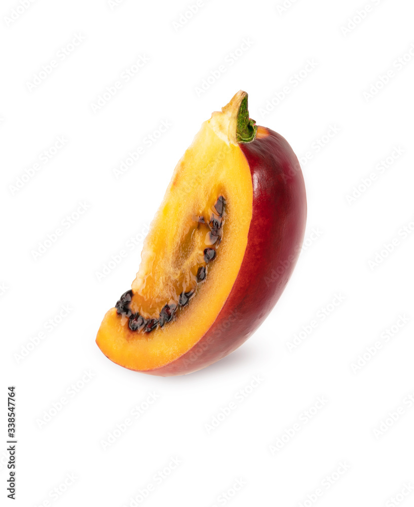Ripe Tamarillo fruit with slices on a white isolated background. toning. selective focus Ripe Tamarillo fruit with slices on a white isolated background. toning. selective focus