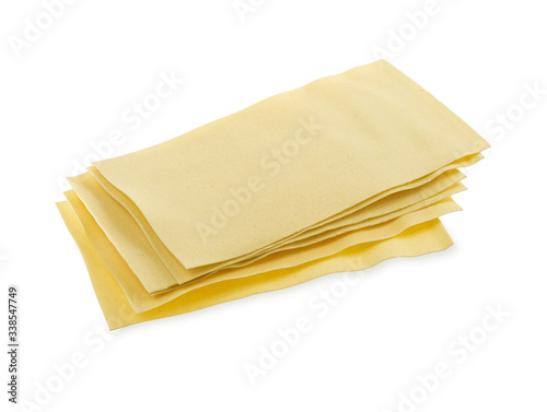 Sheets for lasagna isolated on white background. Pile of dry uncooked Italian pasta