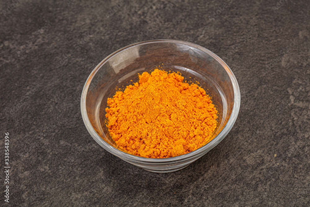 Tumeric powder in the bowl Tumeric powder in the bowl