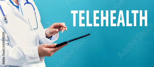 Telehealth theme with a doctor using a tablet computer photo