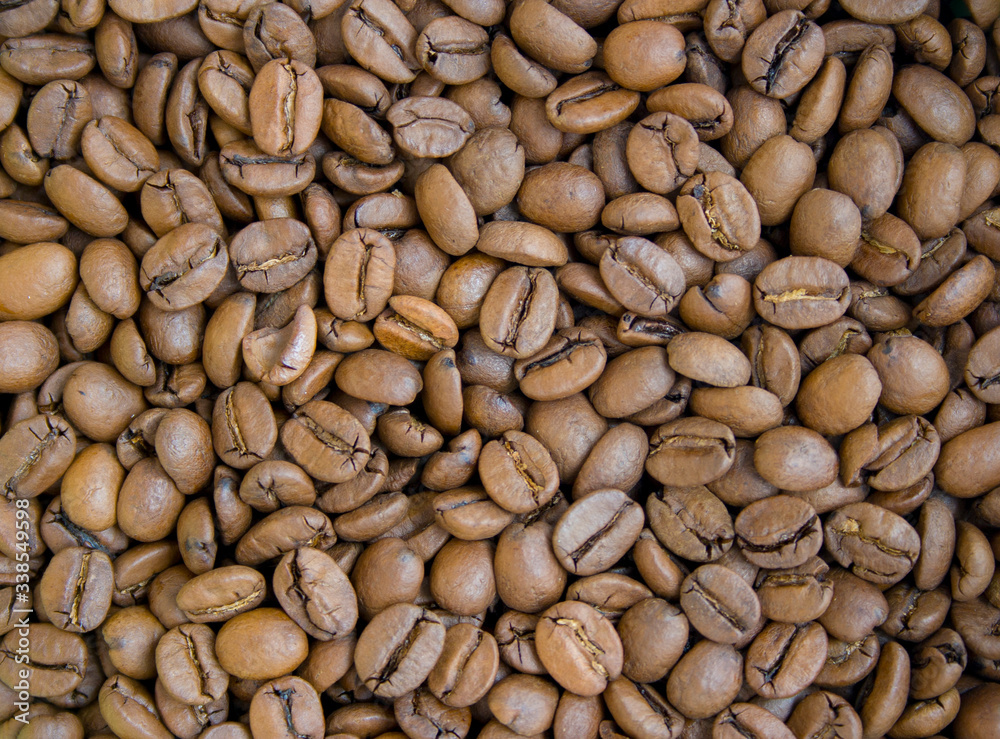 Roasted brown coffee beans close up background Roasted brown coffee beans close up background