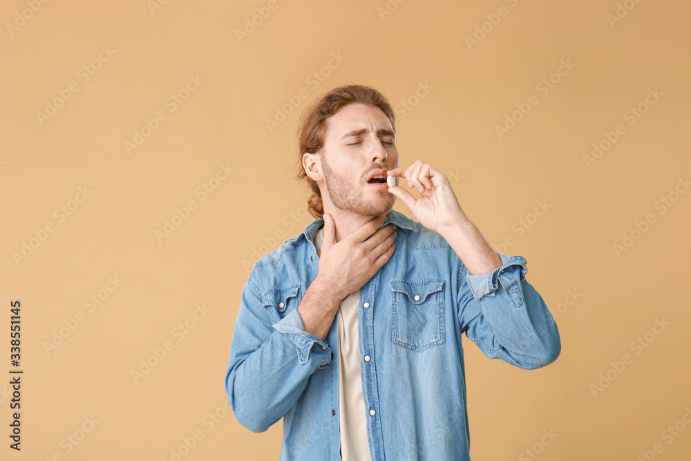 Ill young man on color background Ill young man on color background