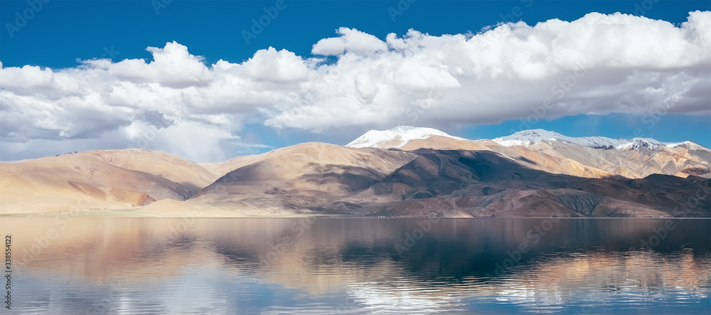 Himalayan mountains mirrored reflected in Tso Moriri mountain Lake water surface near Karzok or Korzok village in the Leh district of Ladakh, India.