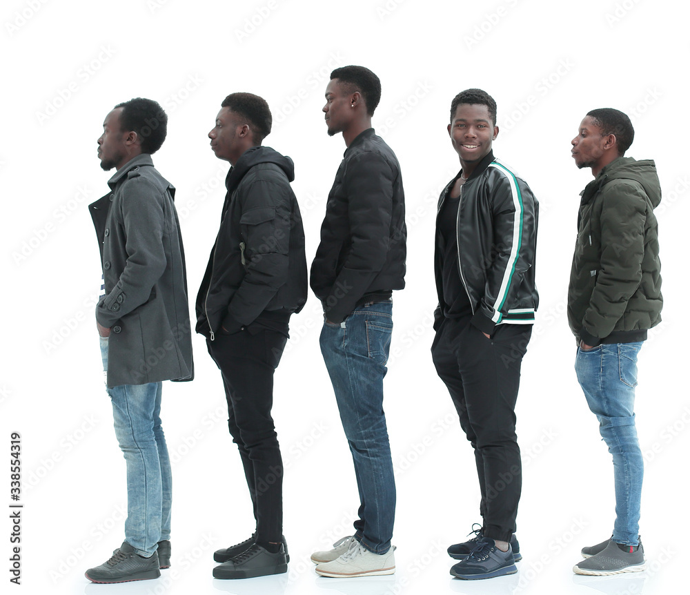 Obraz premium group of diverse guys standing in turns . isolated on white
