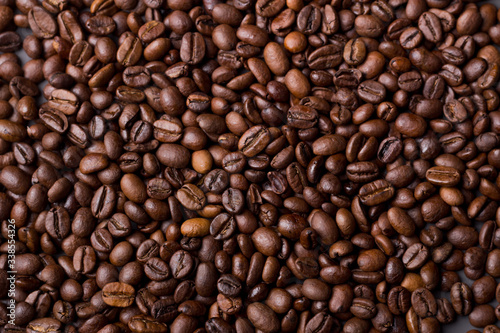 Texture of coffee beans on a gray background