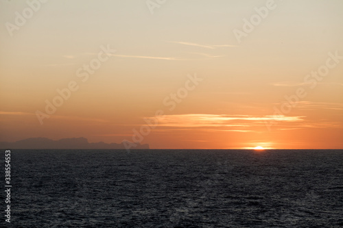 views of the island of mallorca at sunset from menorca