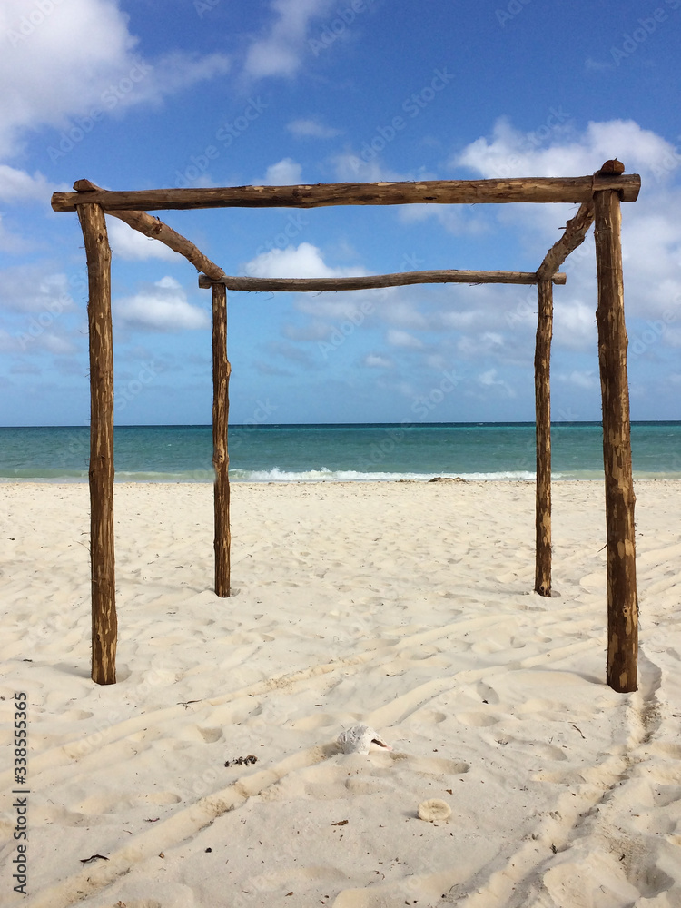 Wooden arbour on a beach in paradise.