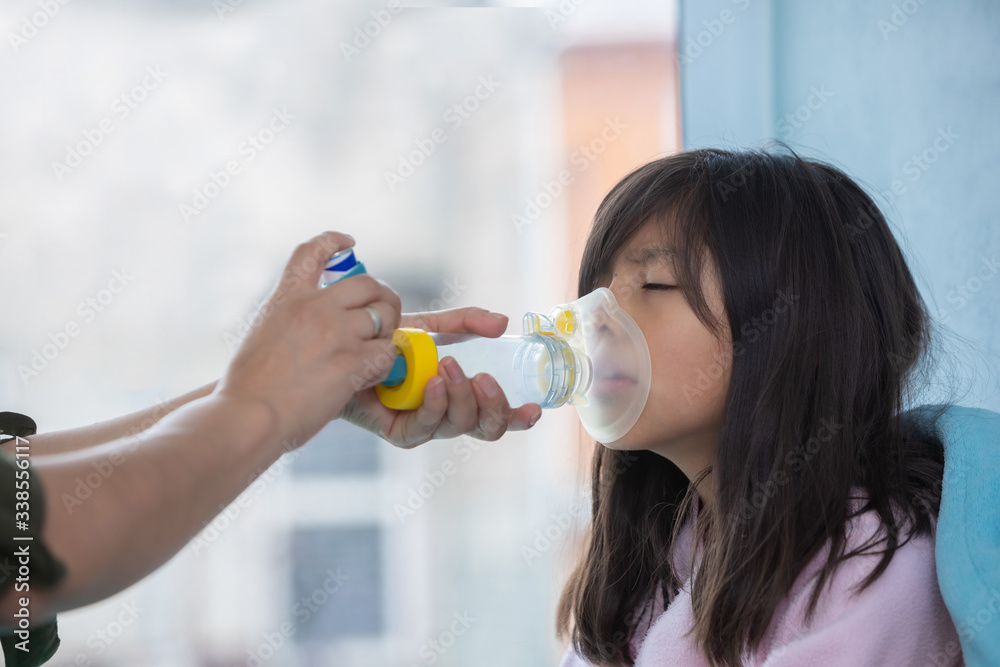 Mexican little girl with respiratory failure due to coronavirus pandemic using inhaler Mexican little girl with respiratory failure due to coronavirus pandemic using inhaler