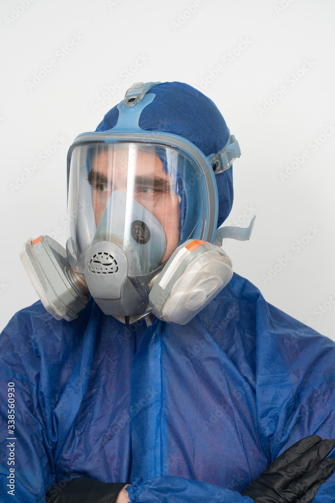 portrait of a man in protective clothing and a mask close up