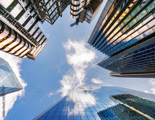 Photography Looking up a reflections on glass covered corporate building
