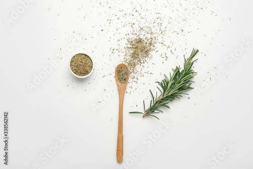 Fresh rosemary and spices on white background