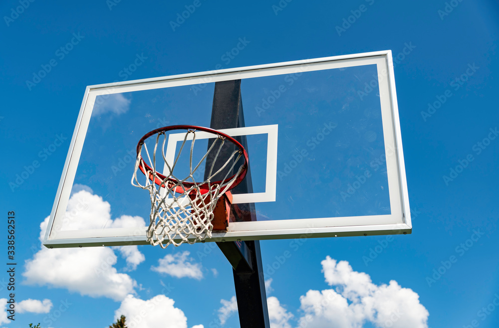 A basket ball hoop on an out door court