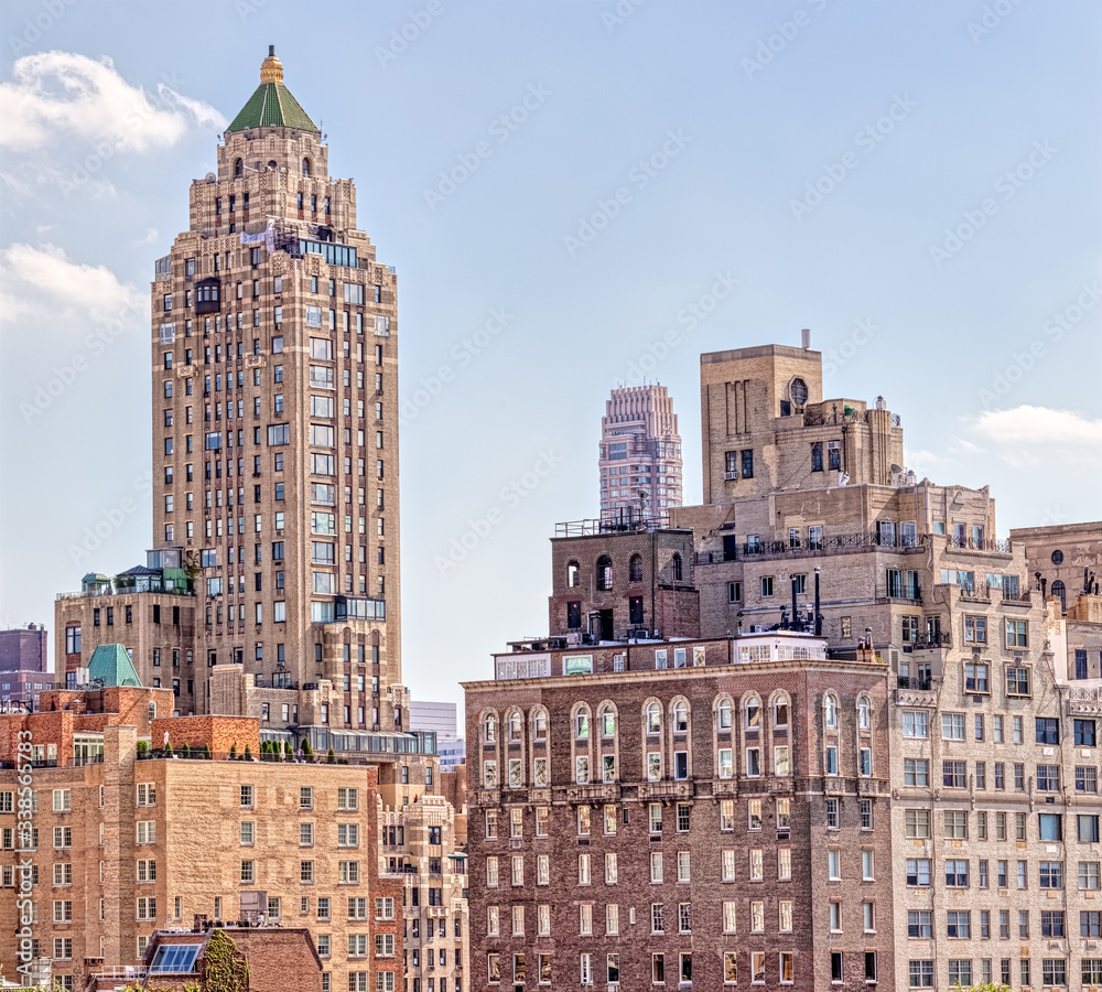 NEW YORK, USA - OCTOBER 1, 2018: The Carlyle, A Rosewood Hotel building view during from the Central Park in New York NEW YORK, USA - OCTOBER 1, 2018: The Carlyle, A Rosewood Hotel building view during from the Central Park in New York